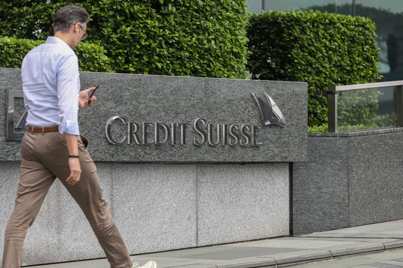 epa10536140 A man walks past the logo of Credit Suisse in Hong Kong, China, 22 March 2023. The Hong Kong Monetary Authority said Credit Suisse‚Äôs assets in Hong Kong made up 0.5 percent of the bankin ...