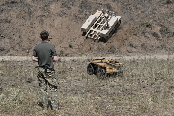 A Ukrainian serviceman from the 93rd Separate Mechanized Brigade controls unmanned ground vehicles on a training ground at an undisclosed location in eastern Ukraine on August 13, 2025, amid the Russi ...