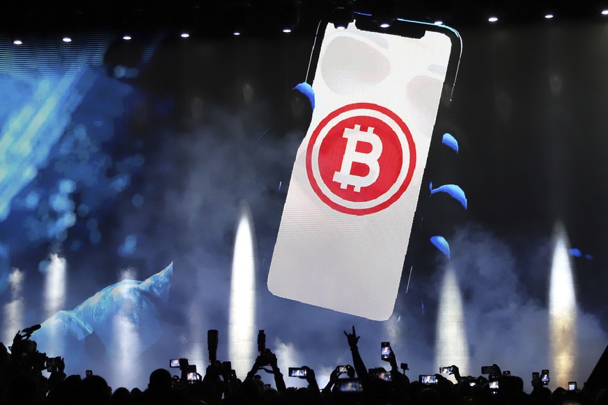 FILE - A bitcoin symbol is presented on an LED screen during the closing ceremony of a congress for cryptocurrency investors in Santa Maria Mizata, El Salvador, Saturday, Nov. 20, 2021. Bitcoin is onc ...