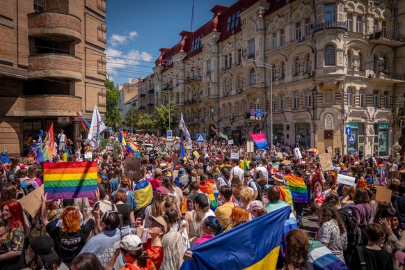 Demonstrators are waving rainbow and Ukrainian flags, filling the main street during the annual 'KyivPride' Equality March in Kyiv, Ukraine, Sunday, June 21, 2026 (AP Photo/Dan Bashakov)