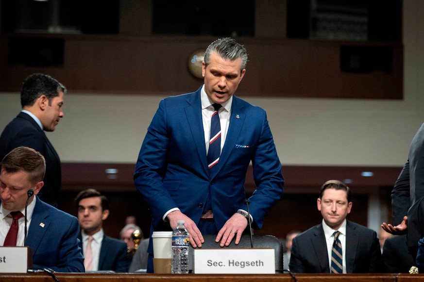 Secretary of Defense Pete Hegseth takes his seat at the witness table to before the Senate Armed Services Committee hearing on the Department of Defense budget, on Capitol Hill, in Washington, Thursda ...