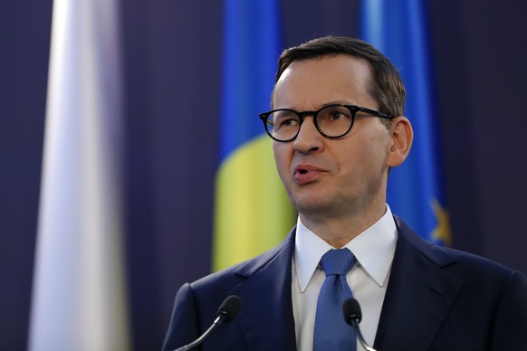 epa10547014 Polish Premier Mateusz Morawiecki, accompanied by his Romanian counterpart Ciuca (not pictured) delivers his statement during a common press conference, held at Victoria Palace, where a co ...