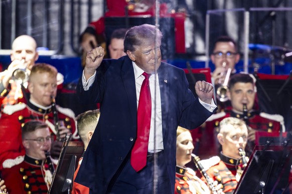 epaselect epa13062461 US President Donald Trump dances after speaking at the opening concert of the Freedom 250 Great American State Fair on the National Mall in Washington, DC, USA, 24 June 2026. Num ...