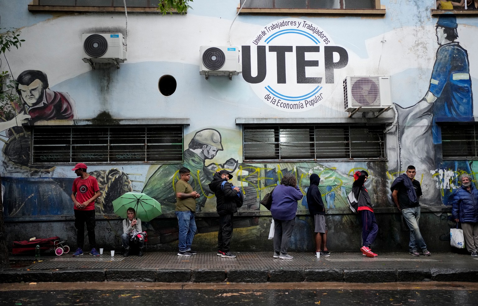 ARGENTINA SOUP KITCHEN
People line up for a free, hot meal outside a soup kitchen run by the Excluded Workers Movement (MTE) in Buenos Aires, Argentina, Wednesday, March 13, 2024. Organizers said the  ...