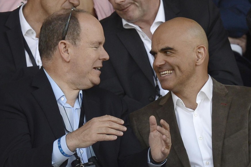 Swiss Federal Councillor Alain Berset, right, and Prince Albert II of Monaco, left, discuss at the Athletissima IAAF Diamond League athletics meeting in the Stade Olympique de la Pontaise in Lausanne, ...