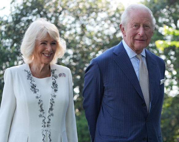 Britain's King Charles III and Queen Camilla stand next to the White House bee hive on the South Lawn of the White House, Monday, April 27, 2026, in Washington. (AP Photo/Alex Brandon, Pool)