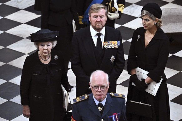 Netherlands Princess Beatrix, left, King Willem-Alexander of the Netherlands and Queen Maxima leave after the funeral of Britain&#039;s Queen Elizabeth II in Westminster Abbey in central London, Monda ...