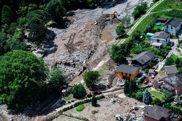 Aerial view of the area affected by the landslide with the houses in the hamlet of Sorte engulfed by stones and earth.. After a landslide, caused by the bad weather and heavy rain in the Misox valley, ...