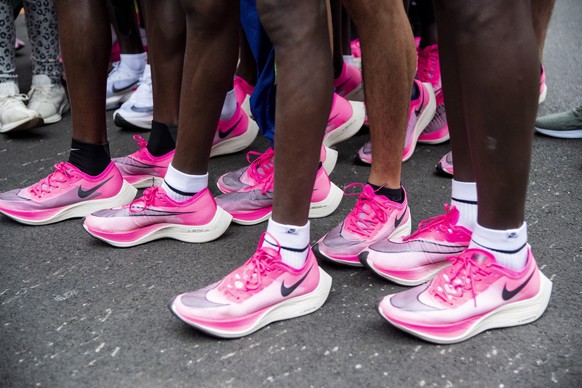 epa07914832 A view of pacemakers wearing pink shoes after the INEOS 1:59 Challenge in Vienna, Austria, 12 October 2019. Kenyan marathon world record holder Eliud Kipchoge attempted on the day to beat  ...