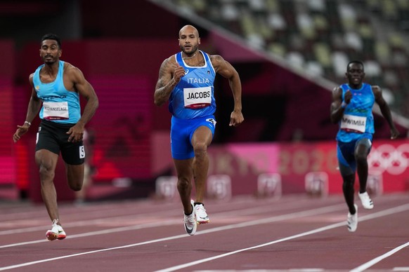 Lamont Jacobs, of Italy, wins a heat in the men&#039;s 100-meter run at the 2020 Summer Olympics, Saturday, July 31, 2021, in Tokyo. (AP Photo/Petr David Josek)