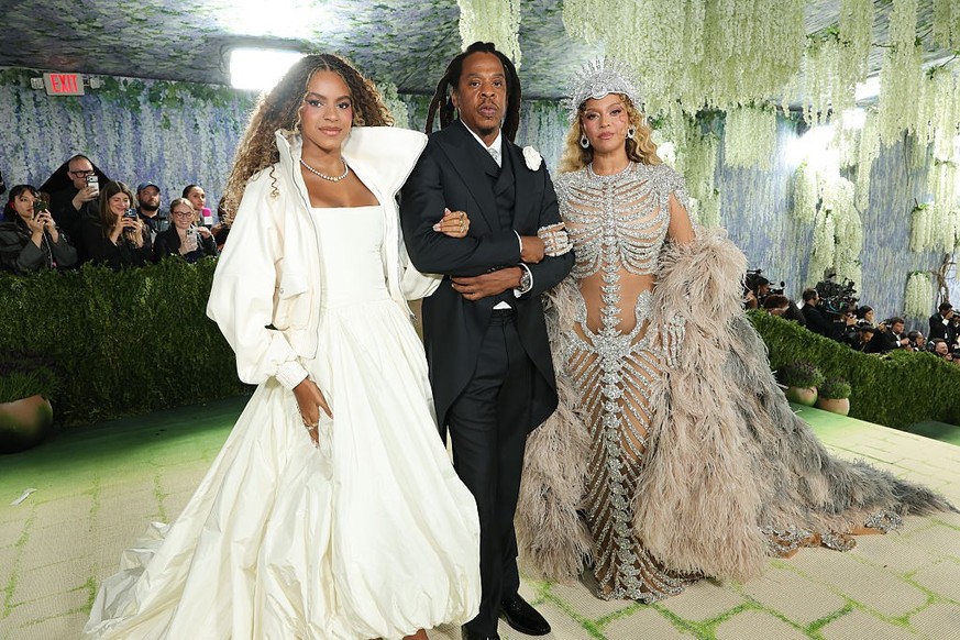 NEW YORK, NEW YORK - MAY 04: (L-R) Blue Ivy Carter, Jay-Z, and Beyoncé attend the 2026 Met Gala celebrating "Costume Art" at the Metropolitan Museum of Art on May 04, 2026 in New York City.  ...