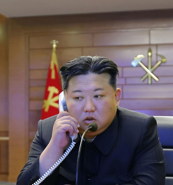 This photo provided by the North Korean government shows its leader Kim Jong Un, right, and his daughter, left, watch what it says the cruise missiles launches from the naval destroyer, the Choe Hyon, ...