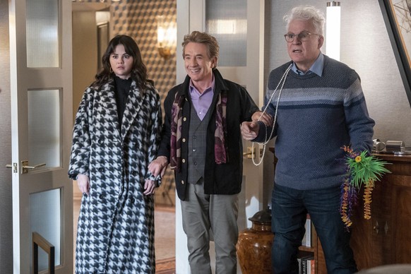 This image released by Hulu shows, from left, Selena Gomez, Martin Short and Steve Martin in a scene from &quot;Only Murders in the Building.&quot; (Patrick Harbron/Hulu via AP)