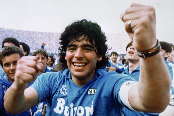 FILE - Argentine soccer superstar Diego Armando Maradona cheers after the Napoli team clinched its first Italian major league title in Naples, Italy, on May 10, 1987. The legend of Diego Maradona at N ...