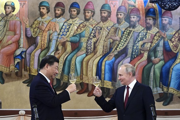 FILE - Russian President Vladimir Putin, right, and Chinese President Xi Jinping toast during their dinner at The Palace of the Facets, a building in the Moscow Kremlin, Russia, on March 21, 2023. Pre ...