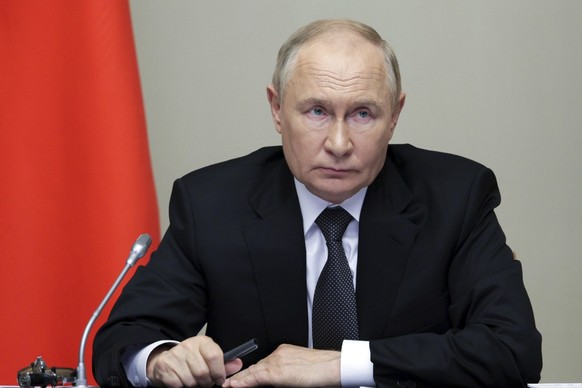 Russian President Vladimir Putin leads the meeting with top security and defence officials dedicated to the situation in Kursk and Belgorod border regions, at Novo-Ogaryovo state residence outside of  ...
