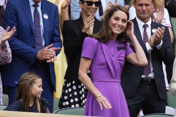 Kate, Princess of Wales reacts as she arrives on Centre Court ahead of the men&#039;s singles final at the Wimbledon tennis championships in London, Sunday, July 14, 2024. (AP Photo/Kirsty Wiggleswort ...