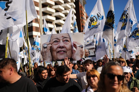 Demonstrators rally with a portrait of Hebe de Bonafini, a late member of the Mothers of Plaza de Mayo human rights group, on the anniversary of the military coup that brought the military regime to p ...