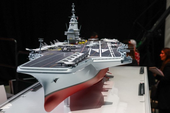 This photograph shows the model of a ship named "France Libre" as French President visits the construction site of Naval Group Nantes-Indret, where the next generation French aircraft carrie ...