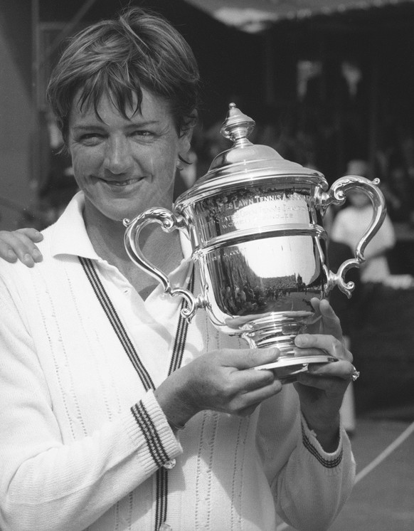 Margaret Court smiles as she holds her trophy after winning her second U.S. Open women&#039;s crown and rare tennis Grand Slam, in Forest Hills, New York, Sept. 13, 1970. The Australian rebounded from ...