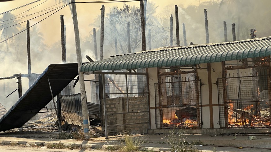In this photo released by the Free Burma Rangers, a building burns in Pasaung, Karenni state, Myanmar in March, 2024, after a Burmese military airstrike and mortars destroyed the town. (Free Burma Ran ...