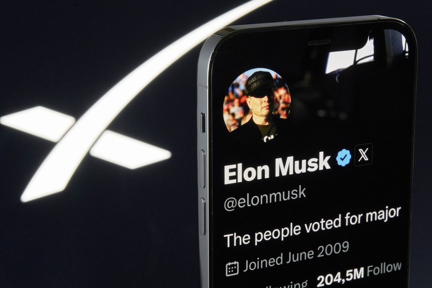 Elon Musks X Profile And SpaceX Official Page Highlighted On IPhone The photo shows Elon Musk s personal X profile displayed on an iPhone, with the official X profile of SpaceX visible in the backgrou ...