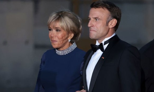 VERSAILLES, FRANCE - SEPTEMBER 20: Brigitte Macron, President of France Emmanuel Macron and Chief of Protocol Jose Pietroboni arrive at the Palace of Versailles ahead of the State Dinner held in honor ...