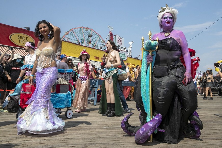 Revelers march during the Mermaid Parade in the Coney Island section of the Brooklyn borough of New York, Saturday, June 17, 2023. (AP Photo/Andres Kudacki)