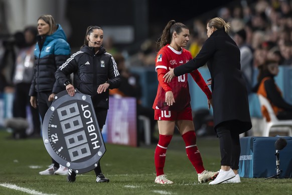Switzerland&#039;s forward Ramona Bachmann, center, reacts next to Switzerland&#039;s head coach Inka Grings, right, during the FIFA Women&#039;s World Cup 2023 soccer match between Switzerland and Ne ...