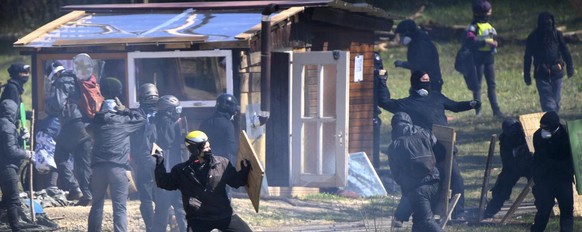 Swiss police officers and protesters clash during the operation of the eviction of environmental protesters from the ZAD de la Colline &quot;Zone A Defendre&quot; (zone to defend) installed by environ ...