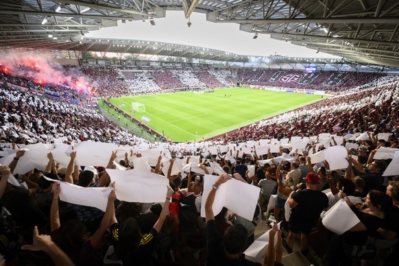 Servette&#039;s supporters cheer in a sould-out stadium before the UEFA Champions League Third qualifying round second leg soccer match between Switzerland&#039;s Servette FC and Scotland&#039;s Glasg ...