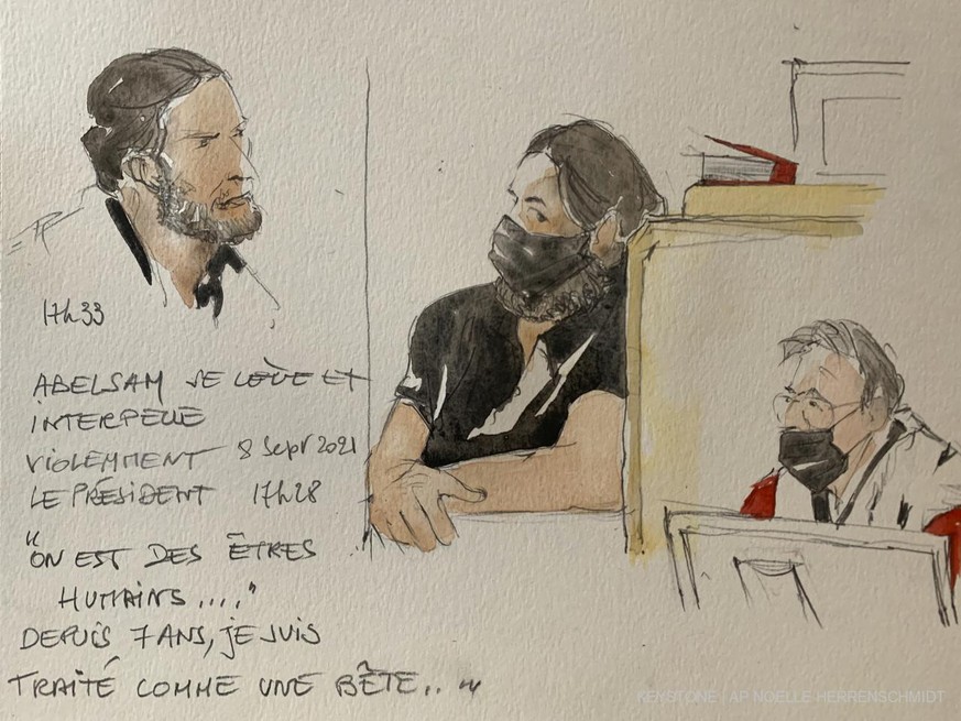 This courtroom sketch shows key defendant Salah Abdeslam, at left and in black at center, with court president Jean-Louis Peries, right, in the special courtroom built for the 2015 attacks trial, Wedn ...