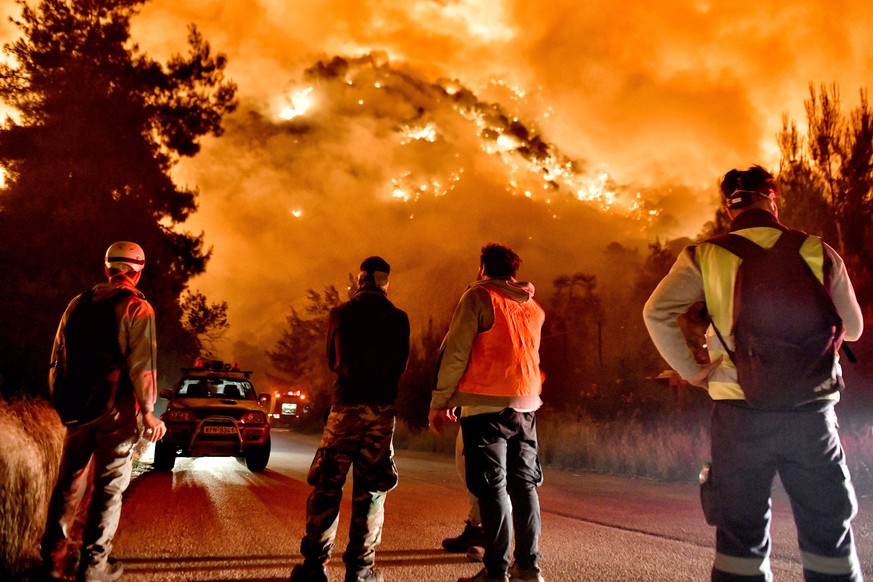 epa09214295 Firefighters battle a forest fire in Schino, Loutraki, Greece, 20 May 2021. Sixty-two fire engines crewed by 182 firefighters, seven teams of firemen on foot, a special Fire Brigade vehicl ...