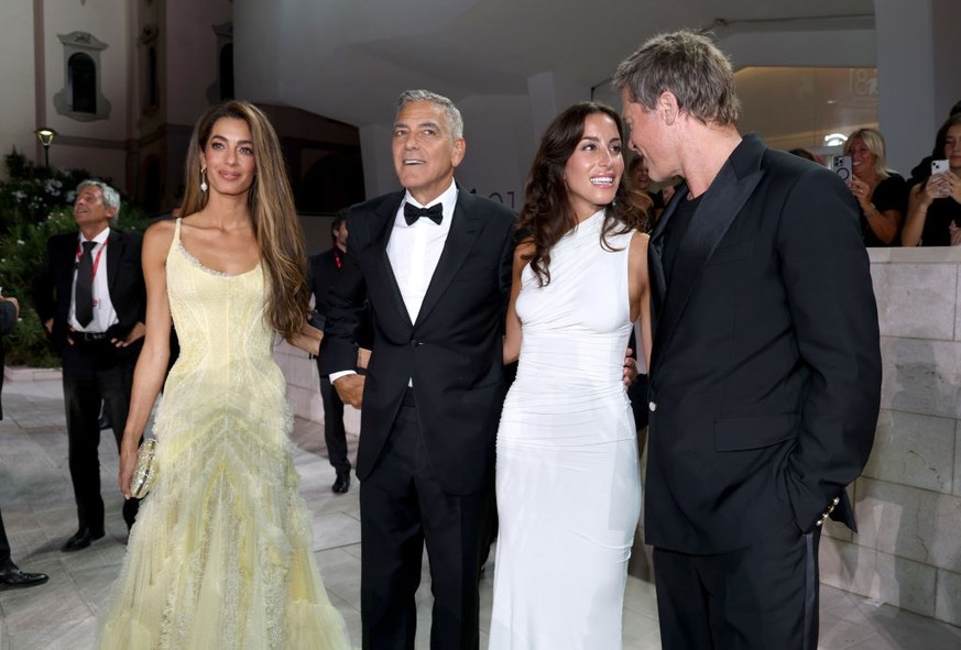 VENICE, ITALY - SEPTEMBER 01: (L-R) Amal Clooney, George Clooney, Ines de Ramon and Brad Pitt attend the &quot;Wolfs&quot; red carpet during the 81st Venice International Film Festival on September 01 ...