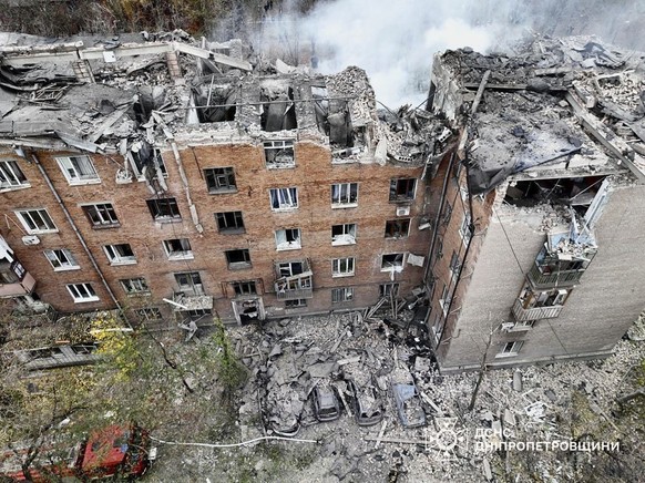 epa11714430 A handout picture made available by the State Emergency Service of Ukraine shows the site of a rocket attack on a five-story residential building in Kryvyi Rih, Ukraine, 11 November 2024 a ...