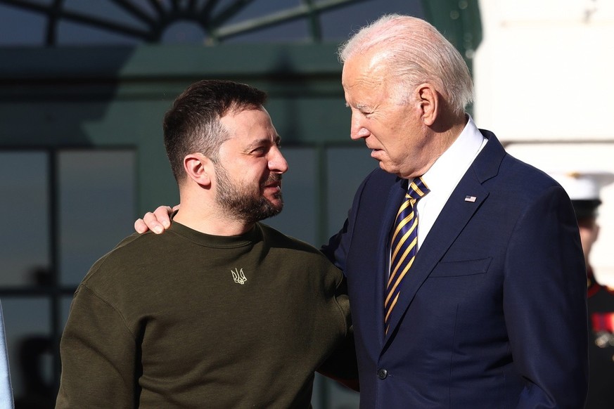 epa10375829 US President Joe Biden (R) welcomes Ukrainian President Volodymyr Zelensky (L) to the South Lawn of the White House Washington, DC, USA, 21 December 2022. In his first trip out of Ukraine  ...