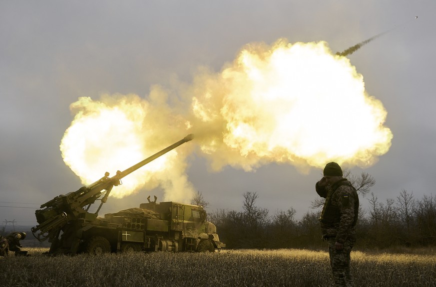 Ukrainian soldiers fire a French-made CAESAR self-propelled howitzer towards Russian positions near Avdiivka, Donetsk region, Ukraine, Monday, Dec. 26, 2022. (AP Photo/Libkos)