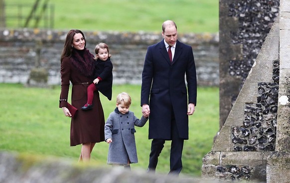 The Duke and Duchess of Cambridge, Prince George and Princess Charlotte arrive to attend the morning Christmas Day service at St Mark&#039;s Church in Englefield, Berkshire. (Photo by Andrew Matthews/ ...