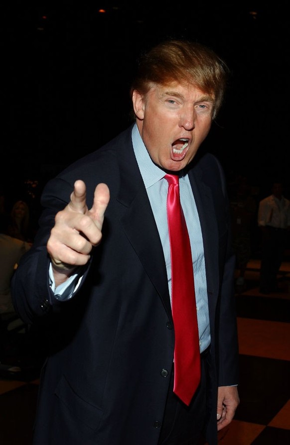 Donald J. Trump blasting a forehand winner from the baseline-with a red, white and blue flag directly over his head. (Photo by Art SEITZ/Gamma-Rapho via Getty Images)