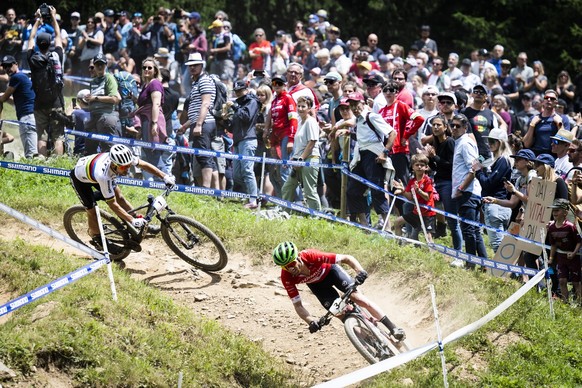 Nino Schurter of Switzerland, left, and Mathias Flueckiger of Switzerland in action during the UCI Cross Country Mountain Bike race, on Sunday, July 10, 2022, in Lenzerheide, Switzerland. (KEYSTONE/Gi ...