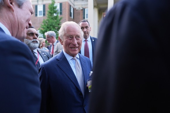 Britain's King Charles III speaks with guests during a garden party at the British Embassy, Monday, April 27, 2026, in Washington. (AP Photo/Julia Demaree Nikhinson, Pool)