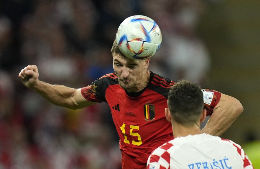 Belgium&#039;s Thomas Meunier, top, duels for the ball with Croatia&#039;s Ivan Perisic during the World Cup group F soccer match between Croatia and Belgium at the Ahmad Bin Ali Stadium in Al Rayyan, ...