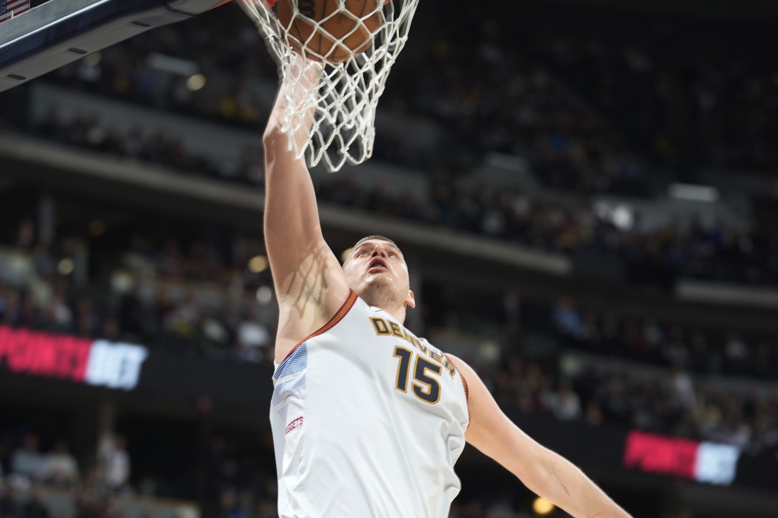 Denver Nuggets center Nikola Jokic dunks against the Minnesota Timberwolves during the second half of Game 5 of an NBA basketball first-round playoff series Tuesday, April 25, 2023, in Denver. (AP Pho ...
