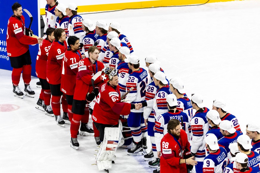 Switzerland's players congratulate the US's players after the victory of the team USA in the gold medal game at the IIHF 2025 World Championship, at the Avicii Arena (Globe), in Stockholm, S ...