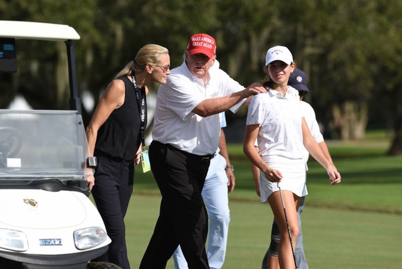 DORAL, FL - OCTOBER 27: Former President Donald Trump, center walks with his niece Kai Trump and her mom Vanessa Trump during the ProAm ahead of the LIV Golf Team Championship, on October. 27, 2022, a ...
