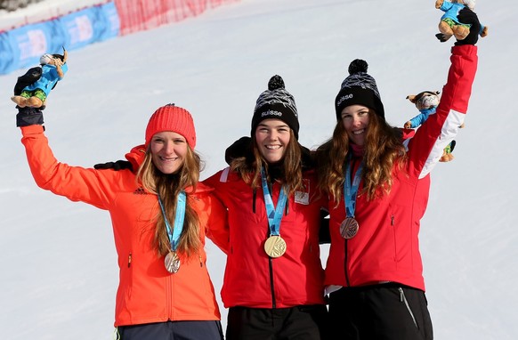 HANDOUT -Silver medalist Katrin Hirtl-Stanggassinger from Germany, gold medalist Melanie Meillard and bronze medalist Aline Danioth, both from Switzerland, from left to right, pose on the podium after ...