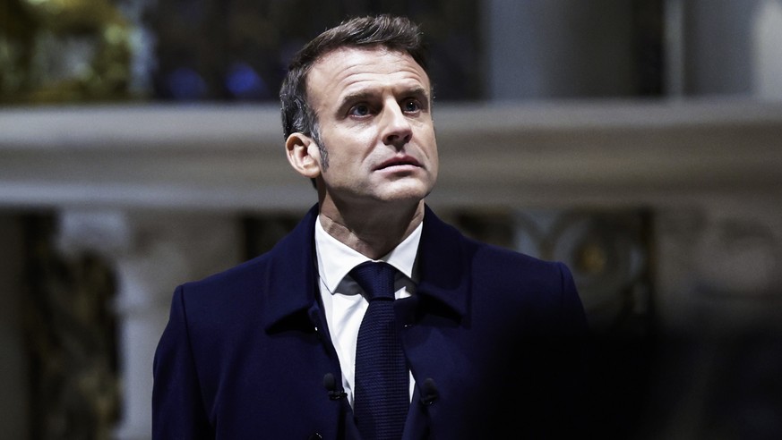 epa11747492 French President Emmanuel Macron looks up during a visit of Notre-Dame de Paris cathedral in Paris, France, 29 November 2024. French President Macron is visiting the cathedral&#039;s const ...