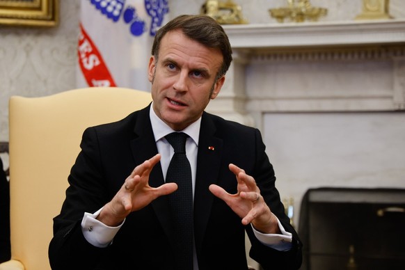 epa11922143 French President Emmanuel Macron speaks during a meeting with US President Donald Trump (not pictured) in the Oval Office of the White House in Washington, DC, USA, 24 February 2025. EPA/L ...