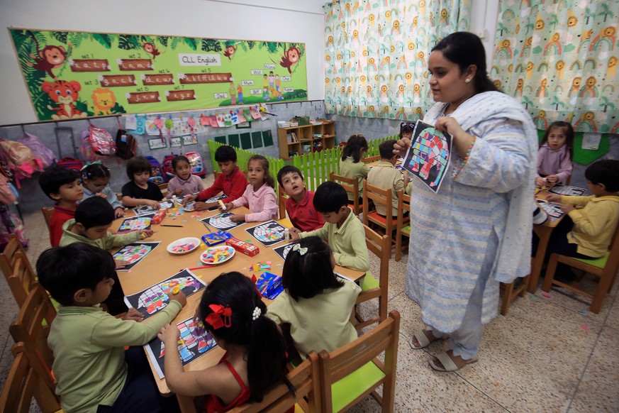 epa11641475 A Pakistani school teacher instructs children at the City School Warsak Campus, a day ahead of World Teachers&#039; Day, in Peshawar, Pakistan, 04 October 2024. World Teachers&#039; Day is ...