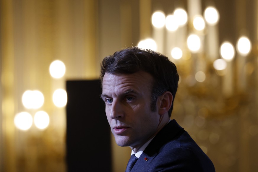 epa09710633 French President Emmanuel Macron delivers a speech during a meeting with representatives of families of 1962 repatriates from Algeria at the Elysee palace in Paris, France, 26 January 2022 ...